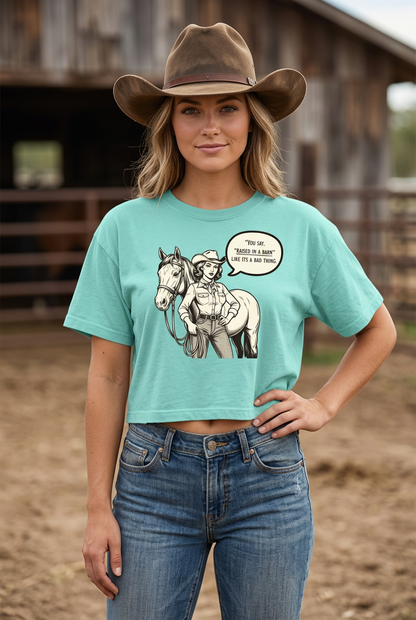 Young adult cowgirl wearing the mint cropped tee untucked